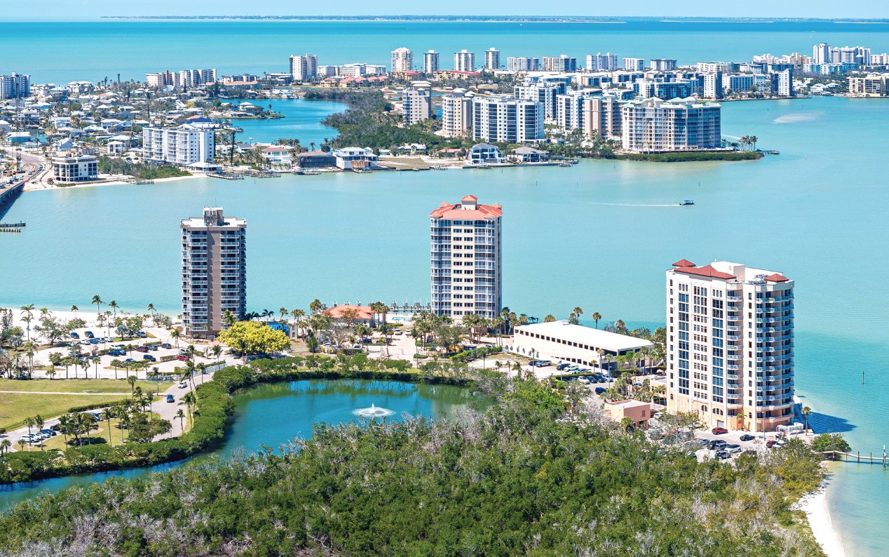 Modern luxury apartment community in Fort Myers with resort-style pool and outdoor lounge spaces.