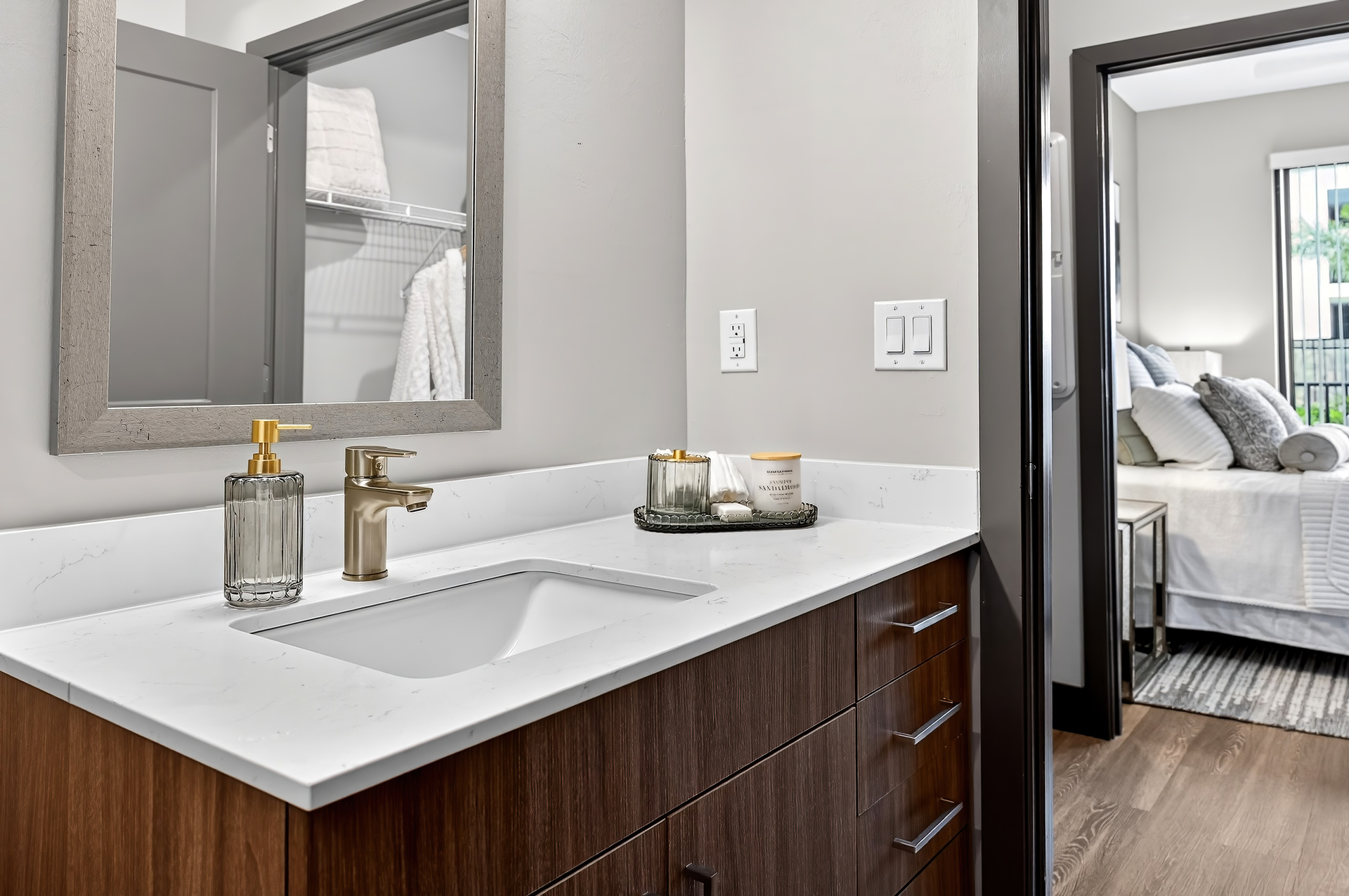 Bathroom vanity with quartz countertop in a one-bedroom apartment at Sinclair at Palm Pointe in Fort Myers, FL